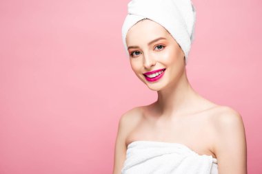 smiling woman in white towel on head isolated on pink 