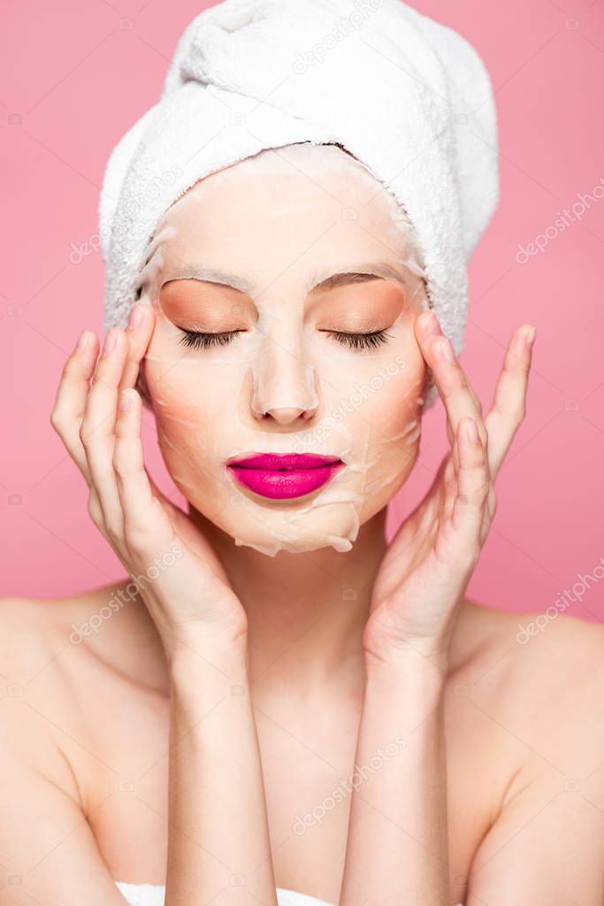 naked girl in moisturizing face mask with closed eyes isolated on pink 