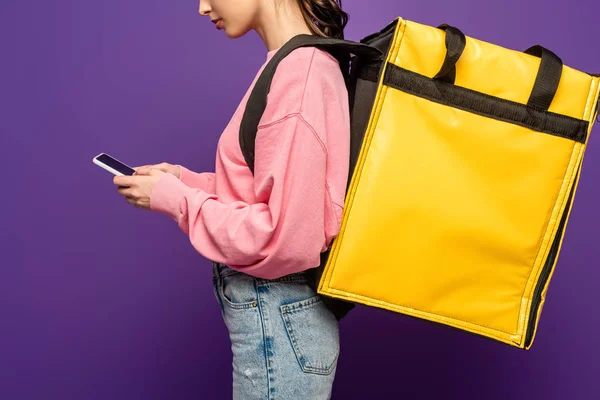 Cropped View Courier Carrying Thermo Box Using Smartphone Isolated Purple — Stock Photo, Image