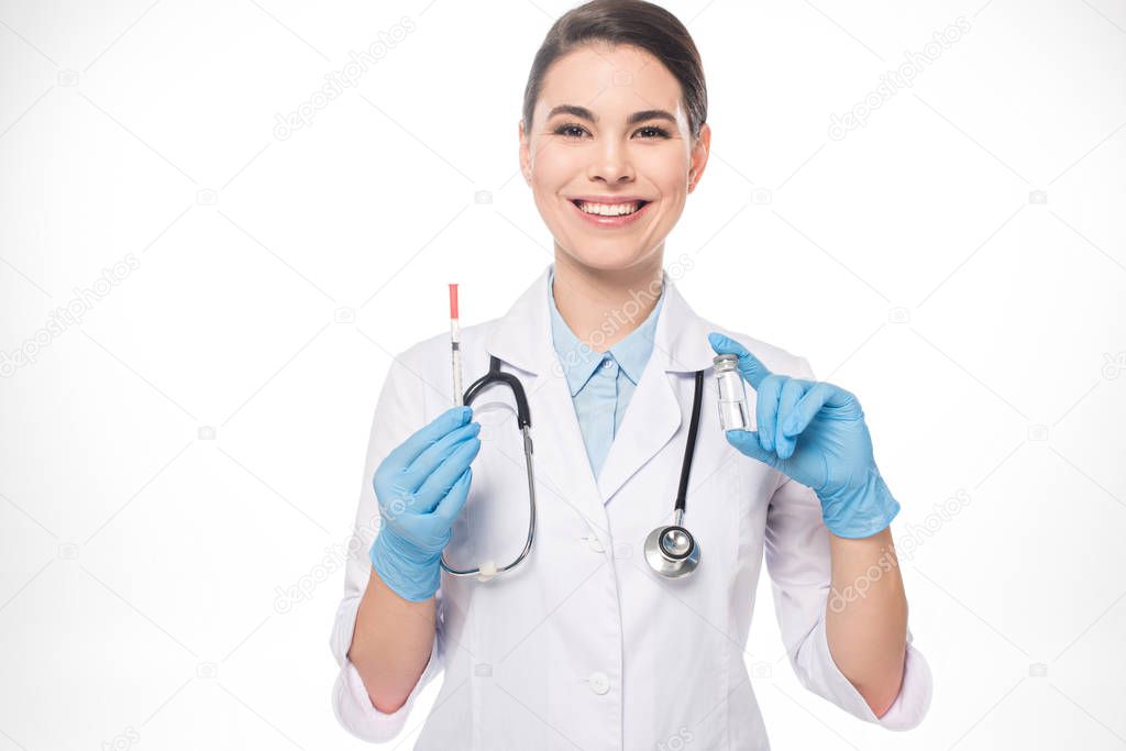 Smiling doctor holding jar with vaccine and syringe isolated on white