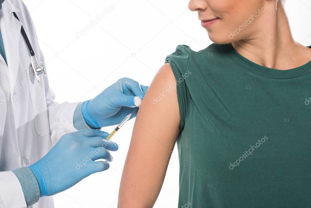 Cropped view of doctor doing vaccine injection to patient isolated on white