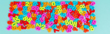Top view of colorful numbers on blue background, panoramic shot clipart