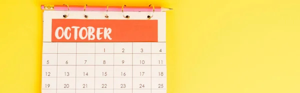 Top View Pencil Calendar October Month Yellow Background Panoramic Shot — Stock Photo, Image