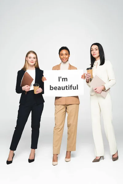 Happy Multicultural Businesswomen Holding Folders Paper Cups Placard Beautiful Lettering — 스톡 사진