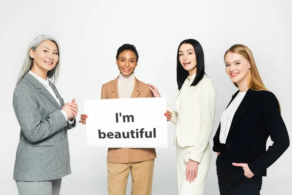 Happy Multicultural Businesswomen Standing Placard Beautiful Lettering Isolated White — Stock Photo, Image