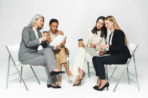 Happy Multicultural Businesswomen Sitting Chairs Paper Cups Laptop White — Stock Photo, Image