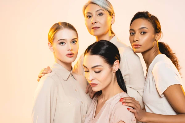 Four Attractive Multicultural Women Makeup Isolated Beige — Stock Photo, Image