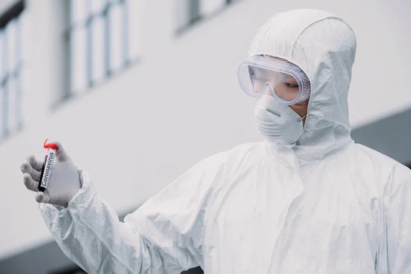 Asian Epidemiologist Hazmat Suit Respirator Mask Holding Test Tube Blood — ストック写真