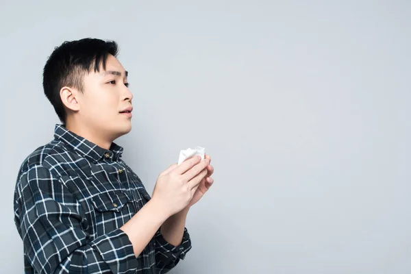 Young Asian Man Holding Paper Napkin While Suffering Runny Nose — Stock Photo, Image