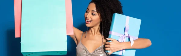 Happy Beautiful African American Woman Silver Dress Holding Gift Box — Stock Photo, Image