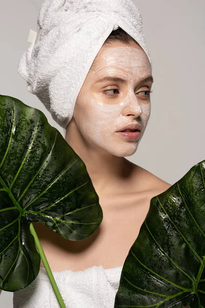 Beautiful Girl Cosmetic Mask Face Towel Head Posing Green Leaves — Stock Photo, Image