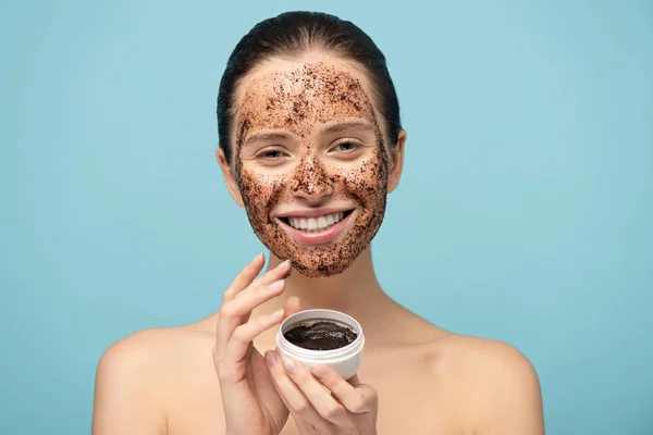 Beautiful Cheerful Girl Applying Coffee Scrub Plastic Container Isolated Blue — Stock Photo, Image
