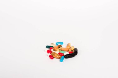 colorful pills isolated on white with copy space  clipart