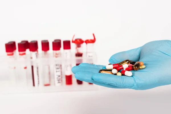Cropped View Scientist Latex Glove Holding Pills Test Tubes Lettering — Stock Photo, Image