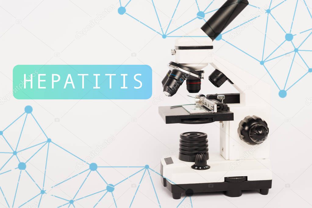Microscope near hepatitis lettering on white