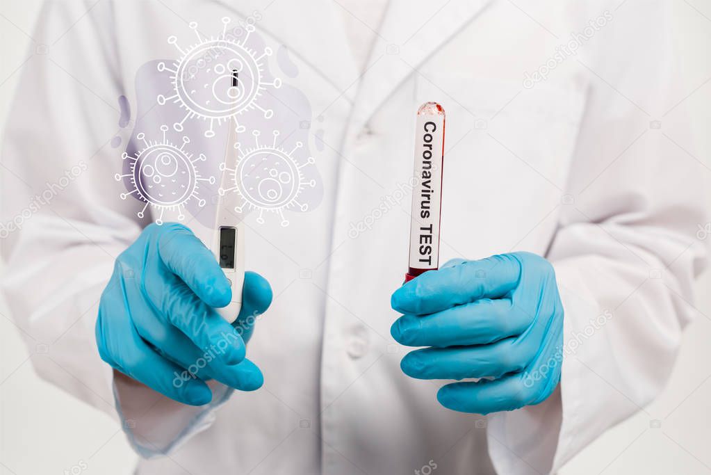 cropped view of scientist holding sample with coronavirus test lettering and digital thermometer near illustration of coronavirus on white 