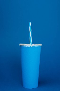 paper cup with plastic straw on blue background  clipart