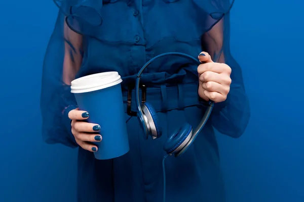 Cropped View Woman Holding Paper Cup Headphones Blue Background — Stock Photo, Image