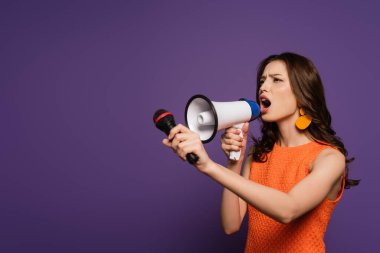 excited girl screaming in megaphone and microphone while looking away on purple background clipart