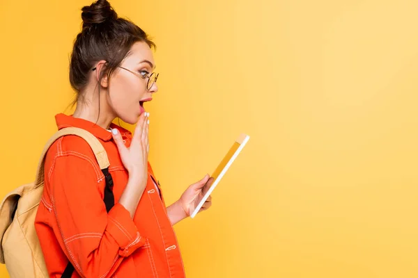 Side View Shocked Student Holding Hand Mouth While Holding Digital — Stock Photo, Image