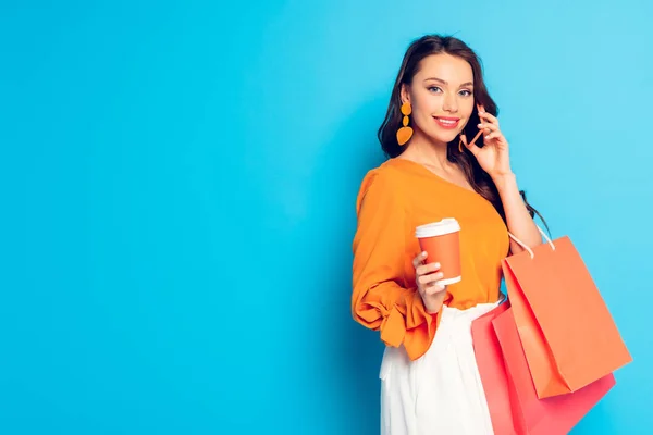 Smiling Elegant Girl Holding Coffee Shopping Bags While Talking Smartphone — Stock Photo, Image