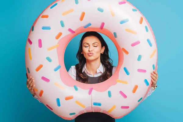 Happy Businesswoman Swim Ring Showing Air Kiss Blue Background — Stock Photo, Image