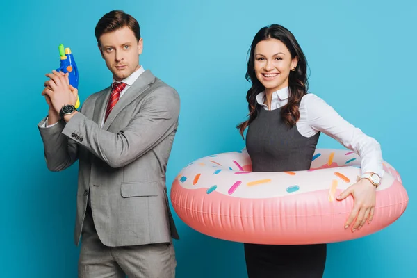 Smiling Businessman Holding Passports Air Tickets Water Gun Joyful Businesswoman — Stock Photo, Image