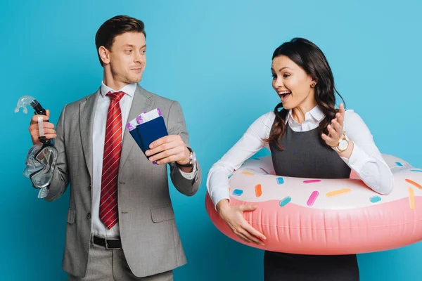 Excited Businesswoman Swim Ring Looking Businessman Holding Passports Air Tickets — Stock Photo, Image