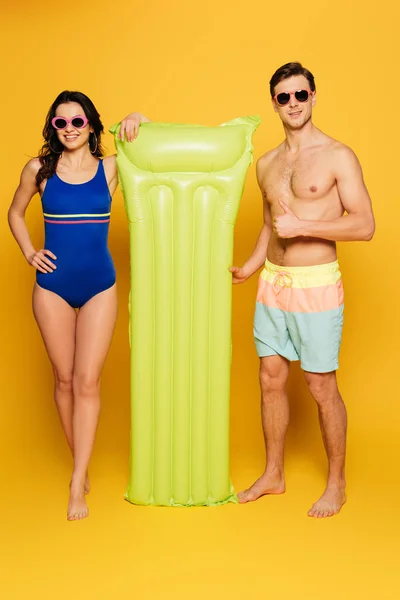 Attractive Woman Swimsuit Shirtless Man Sunglasses Inflatable Mattress Yellow Background — Stock Photo, Image