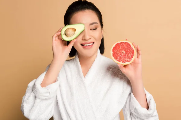 Happy Beautiful Asian Woman Bathrobe Avocado Grapefruit Halves Beige Background — Stock Photo, Image