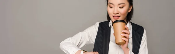 Smiling Young Businesswoman Looking Wristwatch Drinking Coffee Isolated Grey Panoramic — Stock Photo, Image