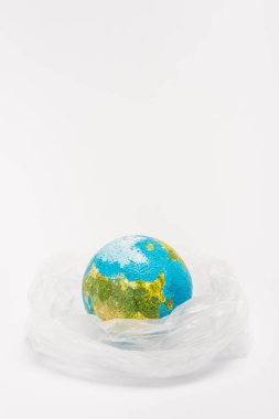 Globe inside plastic bag on white background, global warming concept clipart