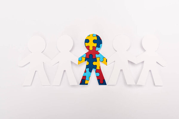 Top view of special kid with autism among another on white