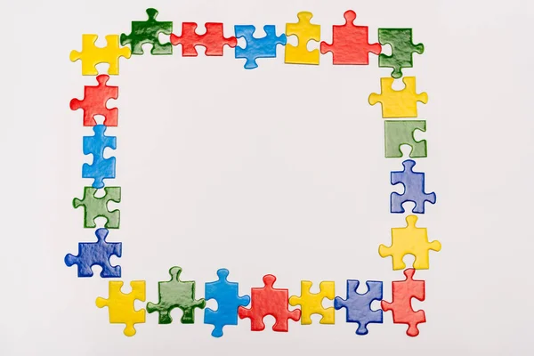 Top View Frame Bright Pieces Puzzle Isolated White Autism Concept — Stock Photo, Image
