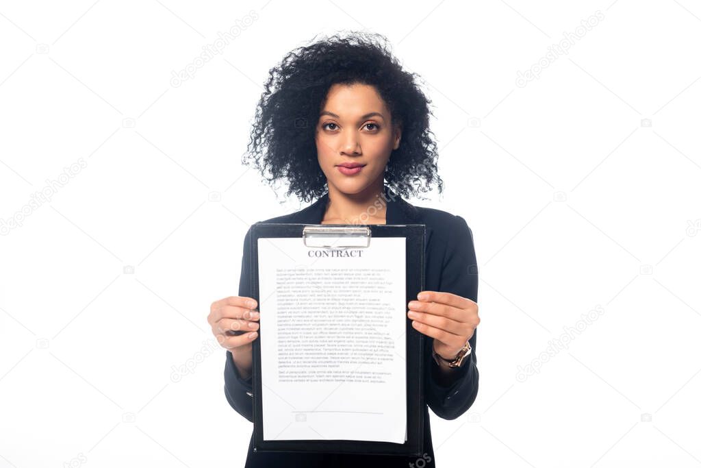 Front view of successful african american businesswoman looking at camera and showing contract isolated on white