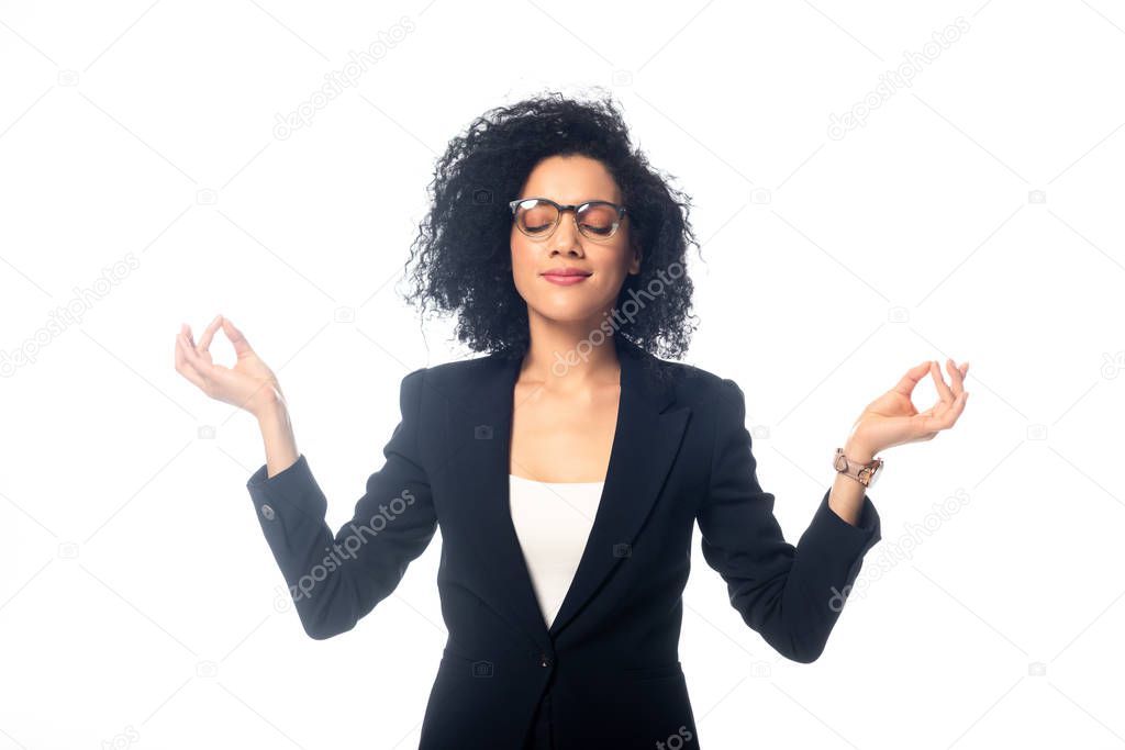 African american businesswoman with closed eyes meditating isolated on white