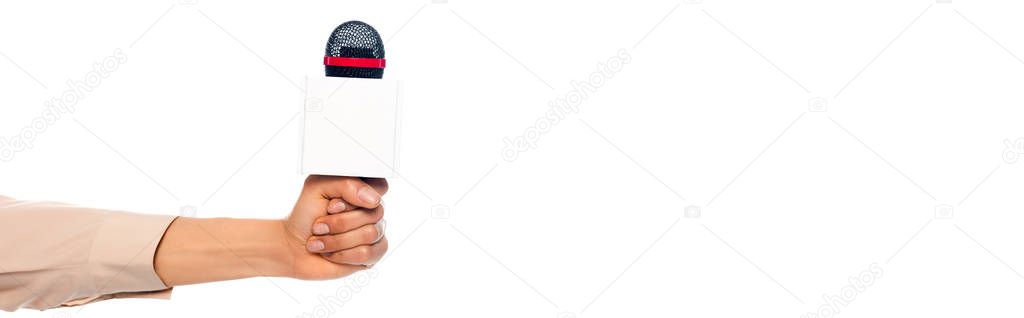 Cropped view of female hand with microphone isolated on white, panoramic shot