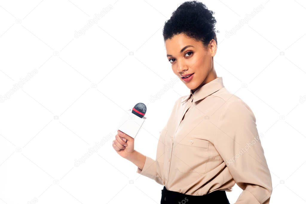 African american journalist looking at camera and holding microphone isolated on white