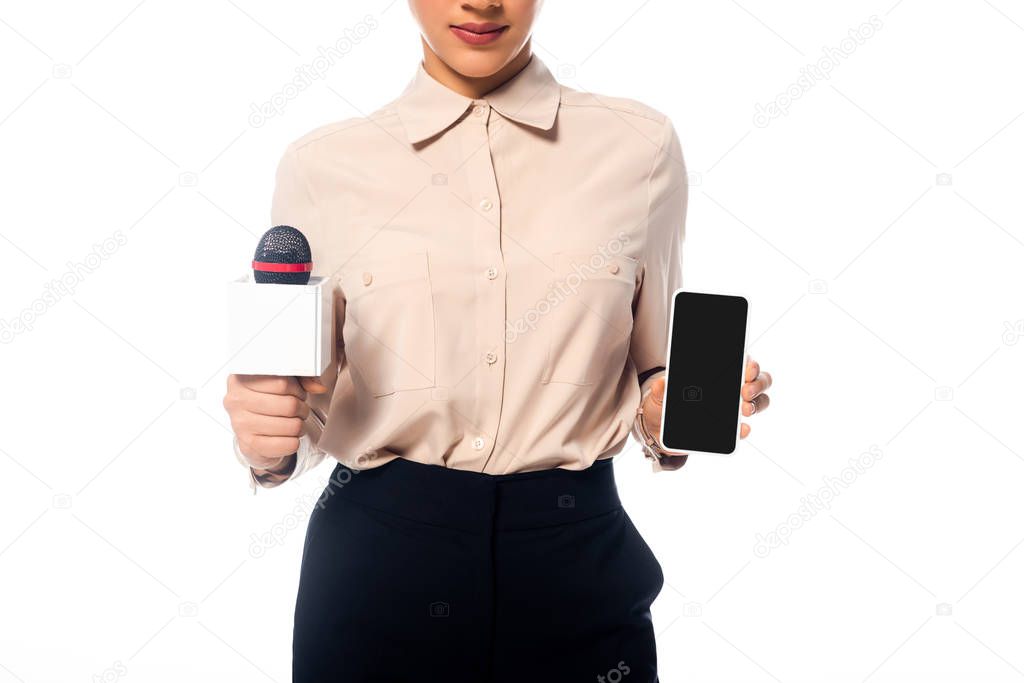 Partial view of african american journalist with microphone showing smartphone isolated on white