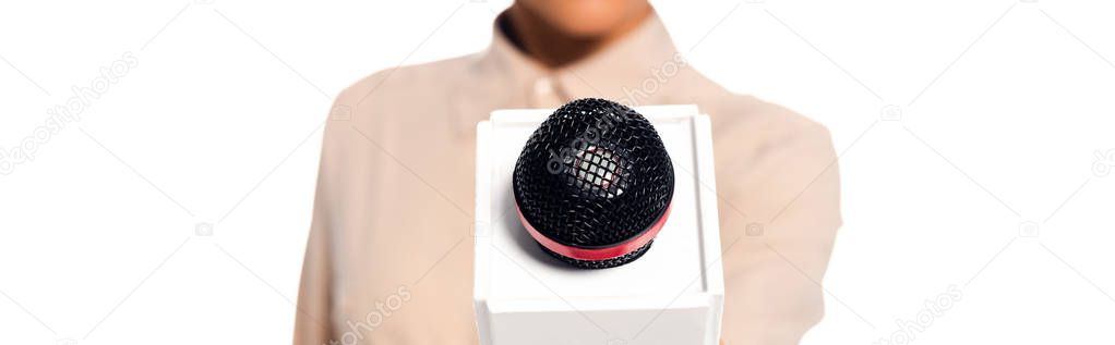 Cropped view of african american journalist presenting microphone isolated on white, panoramic shot