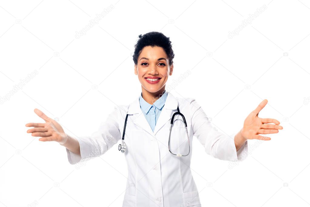 African american doctor with stethoscope and open arms smiling isolated on white