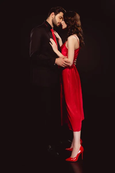 Side View Handsome Man Embracing Beautiful Girlfriend Red Dress Isolated — Stock Photo, Image