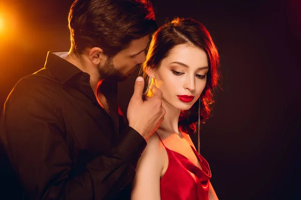 Side View Handsome Man Touching Face Elegant Girlfriend Black Background — Stock Photo, Image