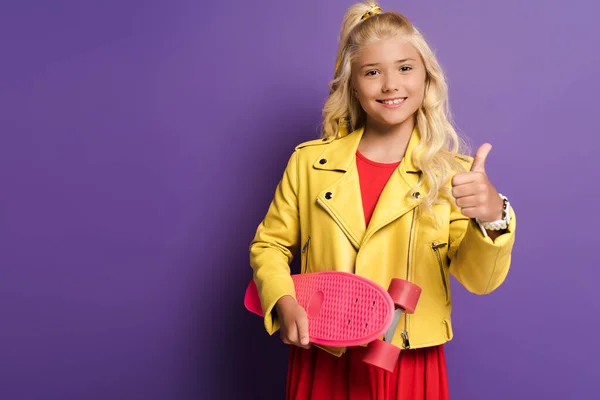 Smiling Kid Holding Penny Board Showing Purple Background — Stock Photo, Image