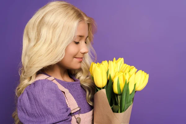 Side View Smiling Kid Holding Bouquet Tulips Purple Background — Stock Photo, Image