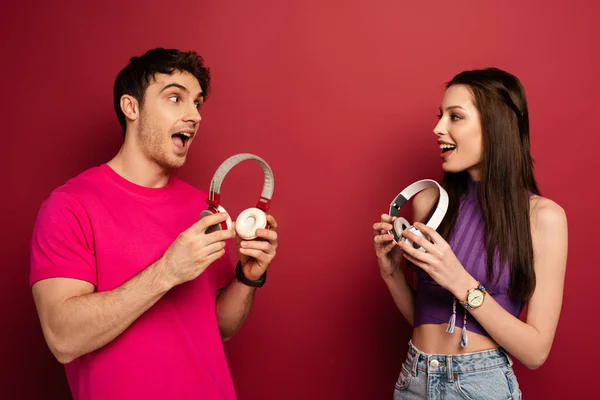 Beautiful Excited Couple Holding Headphones Red — Stock Photo, Image