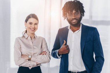 Front view of african american employer with like sigh and recruiter with crossed arms smiling and looking at camera   clipart