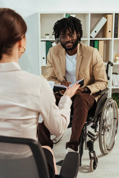 Selective Focus Recruiter African American Disabled Employee Notebook Talking Looking — Stock Photo, Image