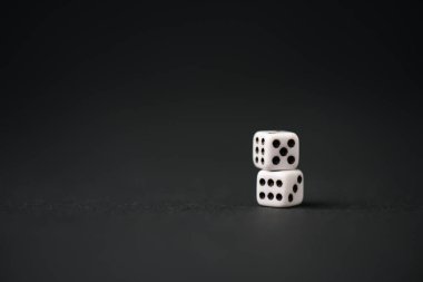 white dice on black with copy space  clipart
