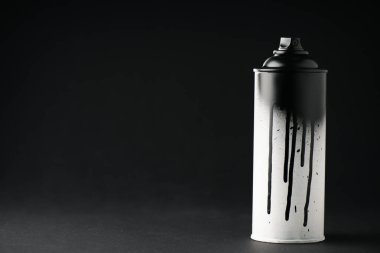 graffiti paint can on black with copy space  clipart